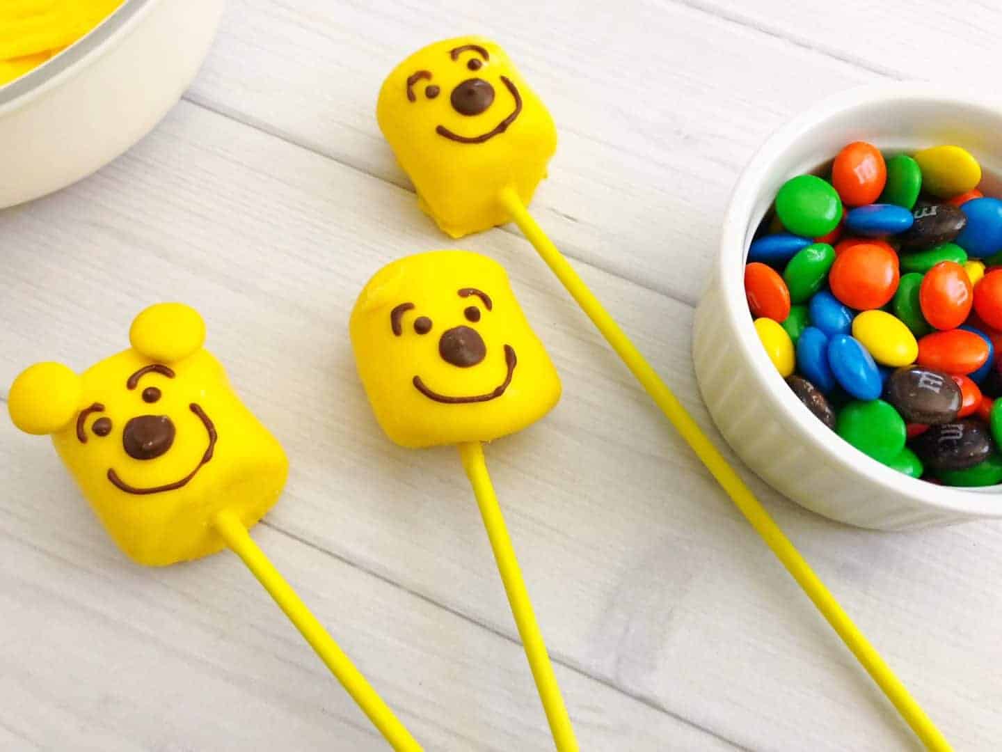 Winnie The Pooh Birthday Cake Pops · The Inspiration Edit